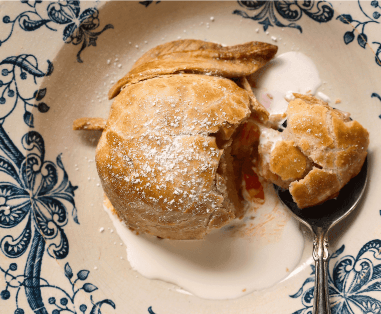 Baked quince pies served with cream